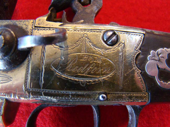A fine late 18th century English tap action over/under brass barreled flintlock pistol — image 5